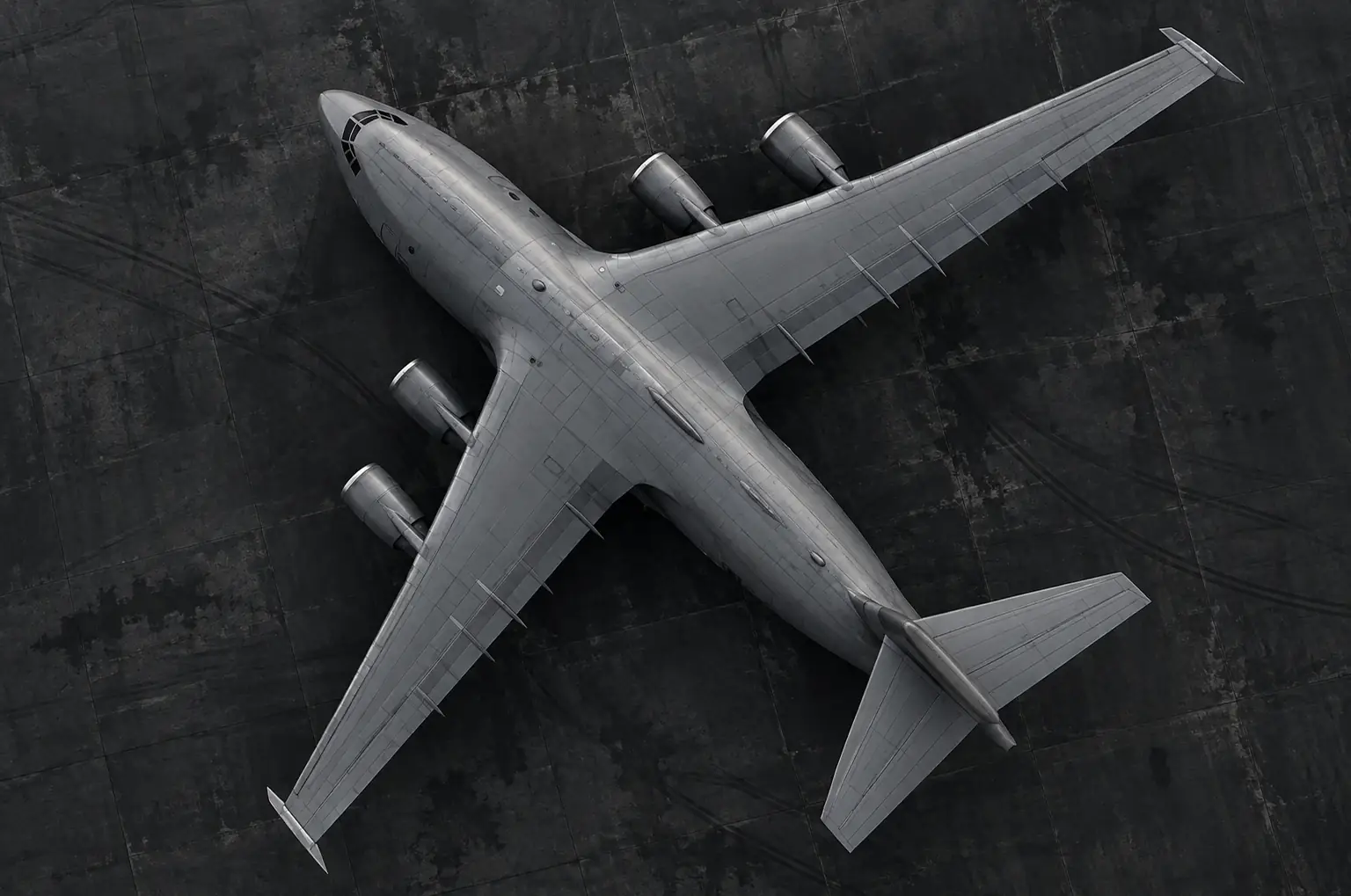 Top-down view of a military transport aircraft on an airfield