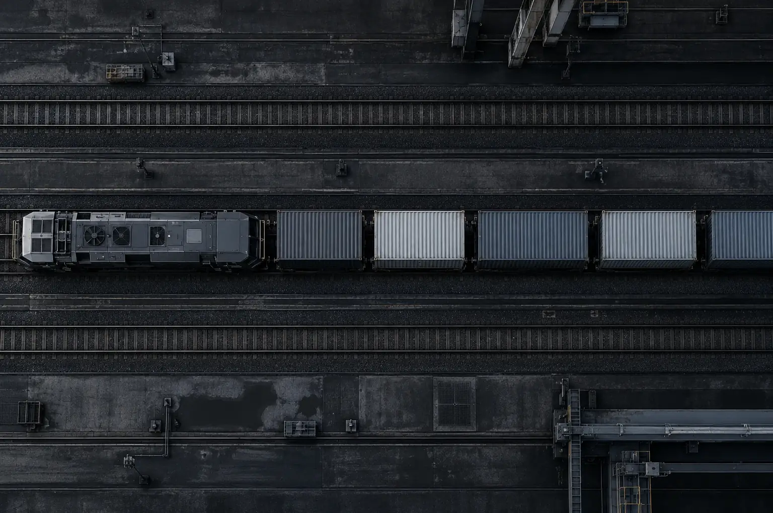 Aerial view of a container train on railway tracks
