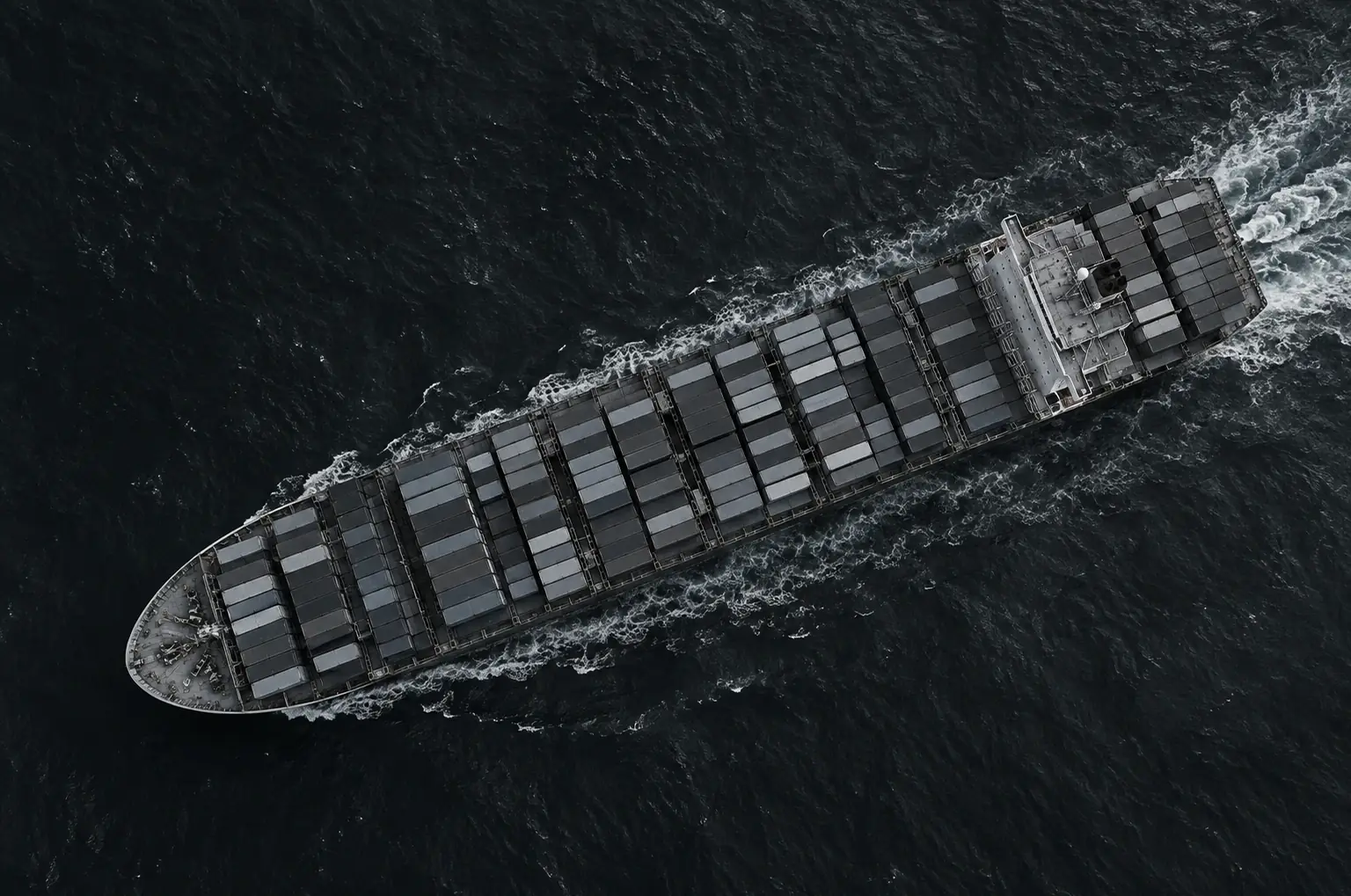 Aerial view of a loaded container ship at sea